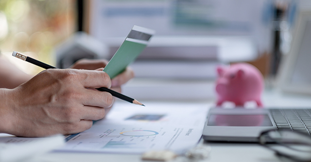 Business man checking his savings